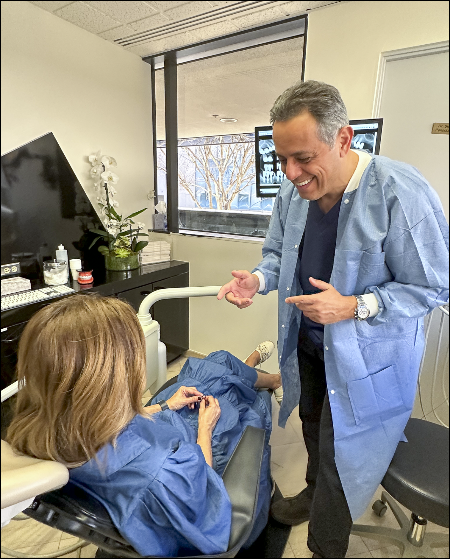 Dr. Baradaran with a patient at his Beverly Hills practice
